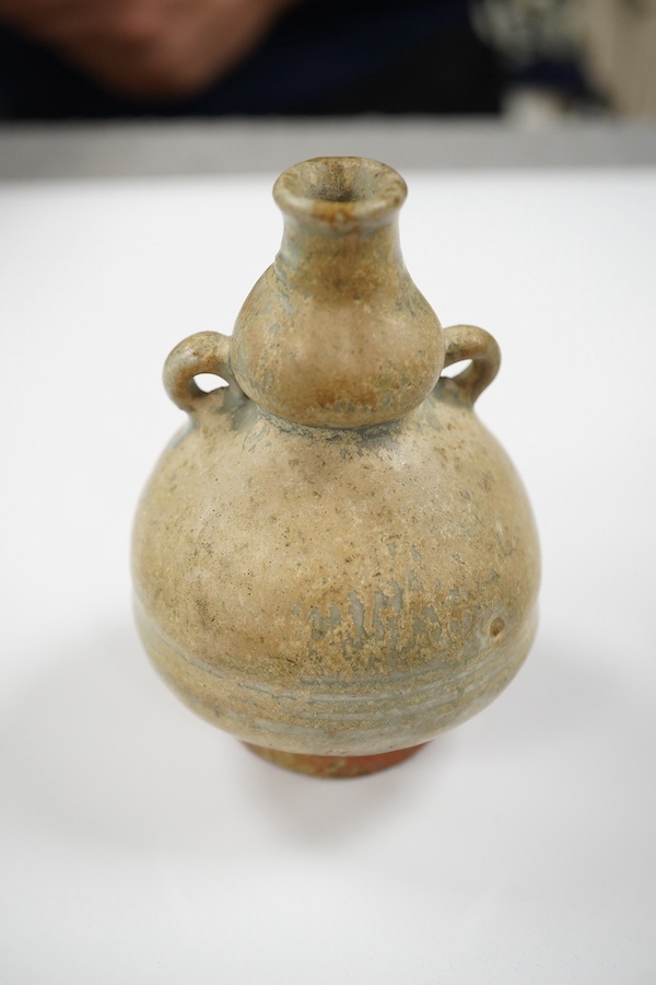 A Chinese blue and white jarlet and a Tang dynasty glazed jarlet, 9cm. Condition - commensurate with age
